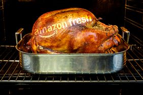 A roast turkey with an Amazon Fresh logo in the oven. 