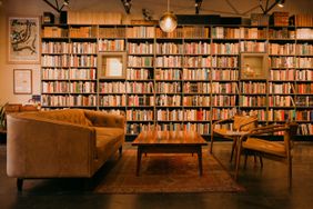 Interior of Bad Animal with full book shelves and seating in Santa Cruz, California.