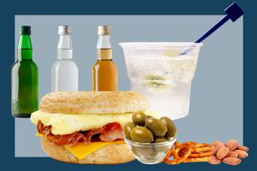 Miniature bottles of alcohol, a cocktail in a plastic cup, a breakfast sandwich and assorted snacks. 