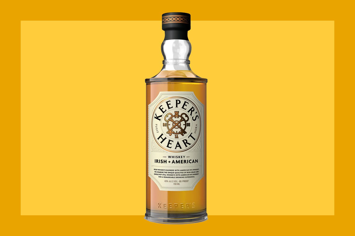 A bottle of Keeper’s Heart Irish + American Blend on a mustard colored background.