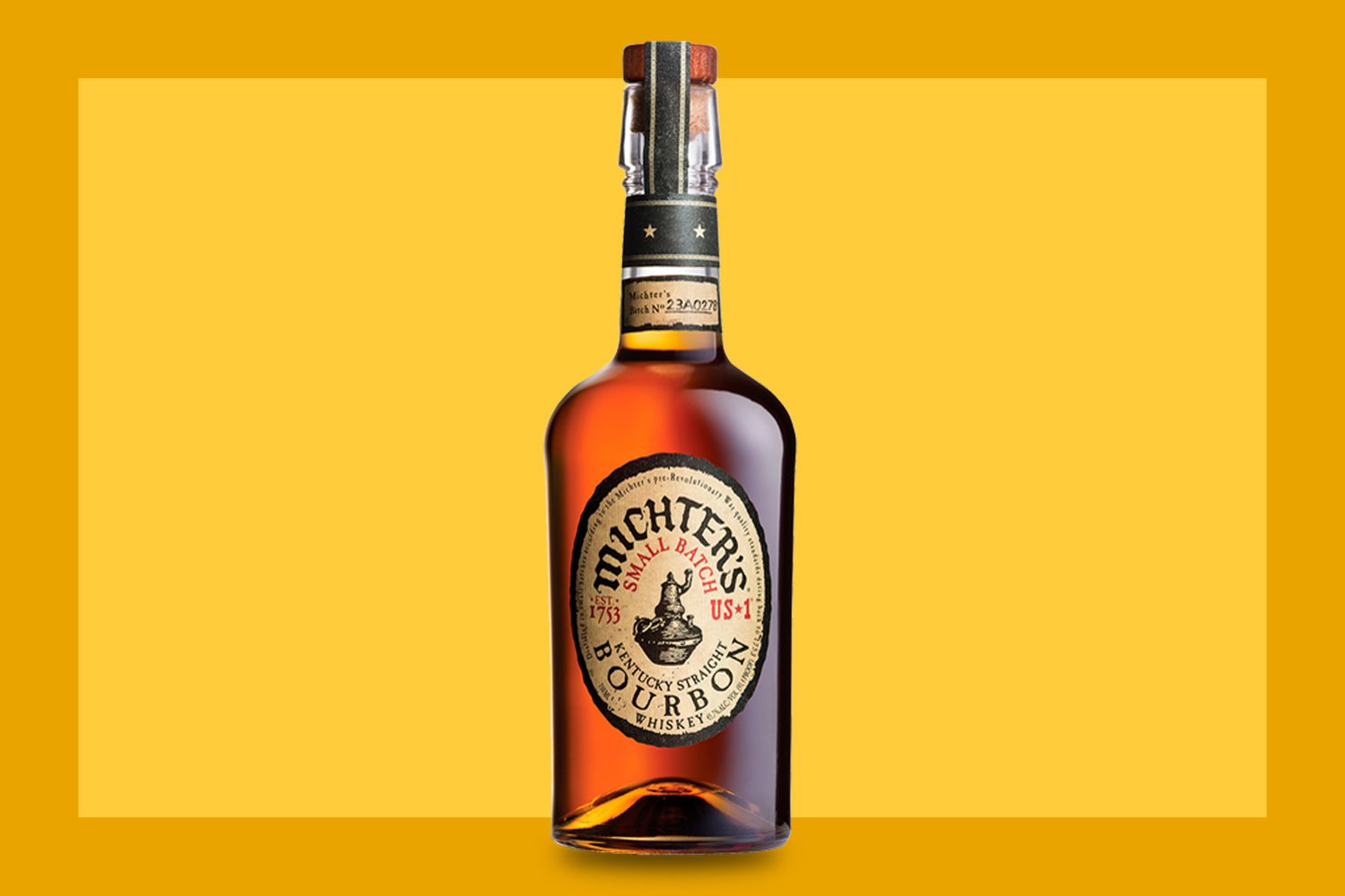 A bottle of Michter’s Bourbon on a mustard colored background. 