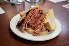 Smoked meat sandwich on a plate at Schwartz's Deli in Montreal, Canada.