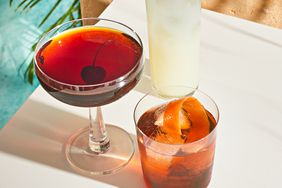 black Manhattan cocktail with a cherry