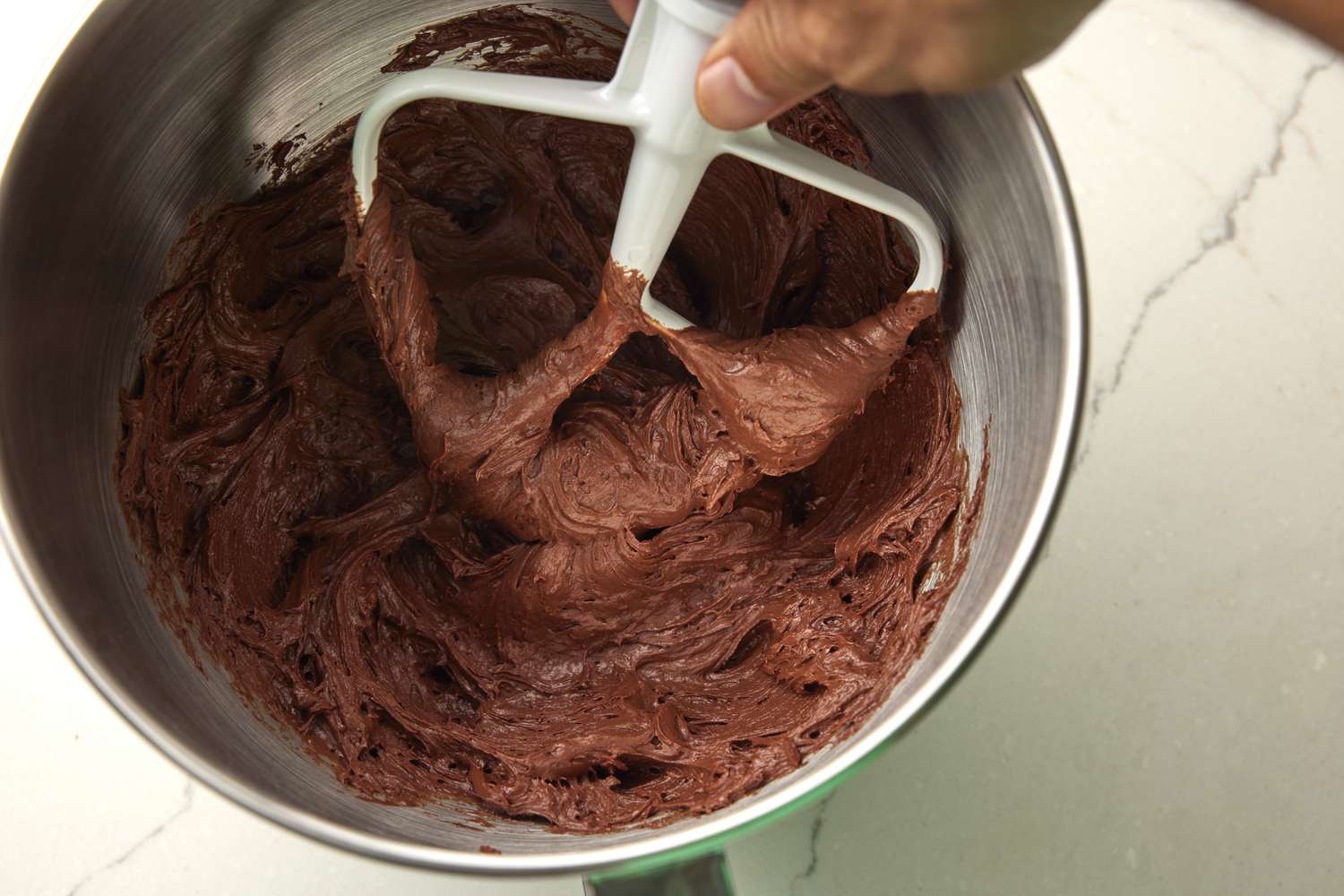 chocolate frosting in mixing bowl