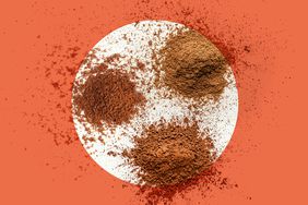 Ground spices on an orange background.