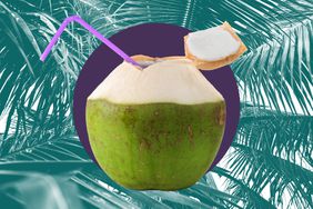 A fresh young coconut in a photo composite with coconut palm leaves.