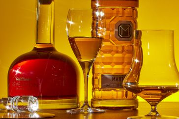 Bottles of cognac and in glasses