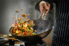 Close up of chef cooking a stir fry