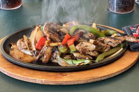 A sizzling platter of fajitas.