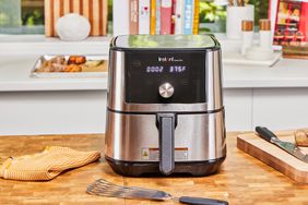 The Instant Vortex Plus 6QT XL Air Fryer on a wooden surface