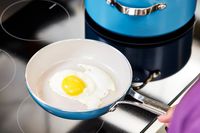 An egg is cooked in the GreenPan Nova Ceramic Nonstick 10-Piece Cookware Set pan