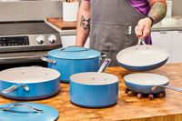 The GreenPan Nova Ceramic Nonstick 10-Piece Cookware Set on a wooden countertop