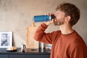 man drinking from thermas 