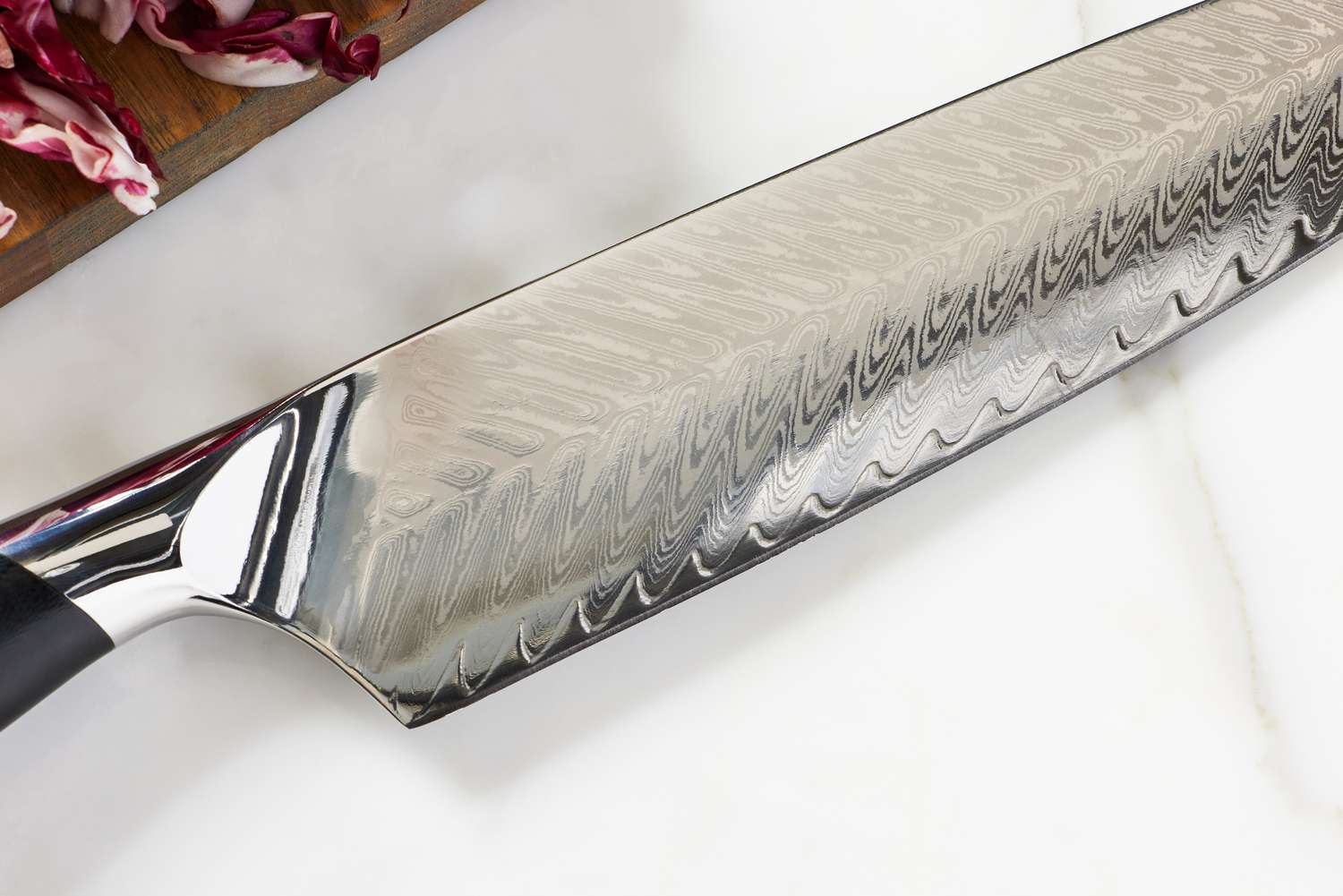 Close-up of the blade on a F.N. Sharp 8-Inch Damascus Steel Chef Knife