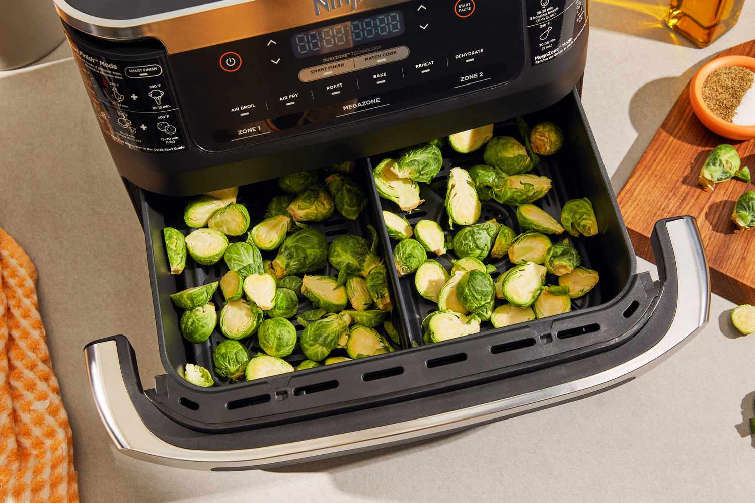 Brussels sprouts inside of the Ninja Foodi FlexBasket Air Fryer with 7qt MegaZone