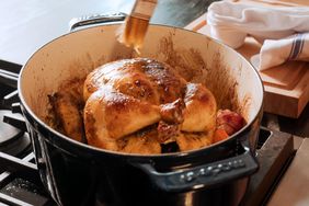 dutch oven with chicken cooking