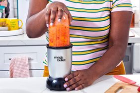 A person blending a smoothie using the Magic Bullet Blender 