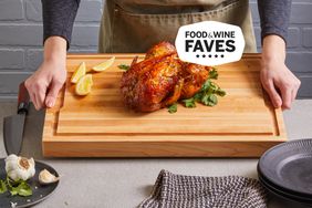 Person holding Made In The Butcher Block Cutting Board