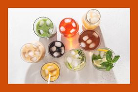 Various non-alcoholic drinks in glasses with ice on a speckled white background. 