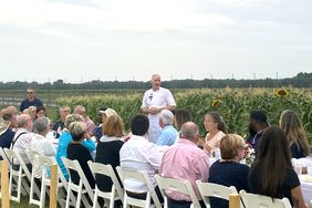 Chef Brandon speaking to dinner guests at Grafton Correctional Facility.