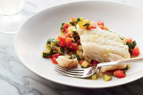 Olive Oil-Poached Hake on Saut&eacute;ed Zucchini with Tomatoes