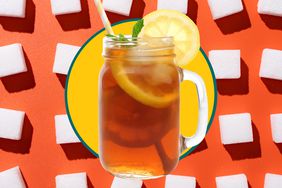 A mug of sweet tea and sugar cubes over an orange background. 