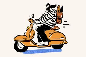 A person rides a vespa