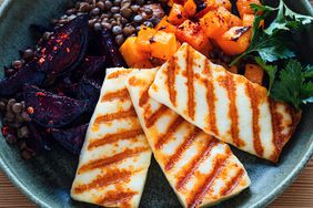 Pumpkin, grilled hallumi, beet, and lentil bowl