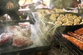 Picanha, potatoes, and carrots being cooked.