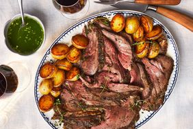 Leg of Lamb Cooked Over New Potatoes with Spicy Mint-Rum Sauce