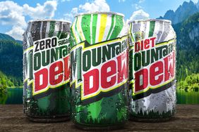 Three cans with the new Mountain Dew branding. 