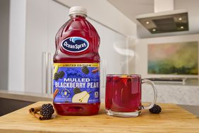 Ocean Spray's Limited Edition Mulled Blackberry Pear drink on a cutting board.