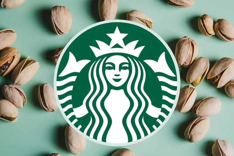 The Starbucks logo over a light green background with shelled pistachios. 