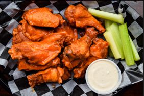 Basket of buffalo wings and celery from Sidelines Sports Bar and Grill in Buffalo, NY.