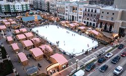 A three quarter angle shot of the Carmel Christkindlmarkt and ice rink during the day.