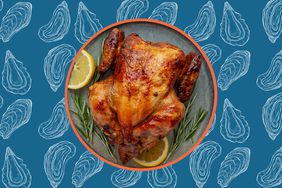 A roast chicken over a background of oyster illustrations. 