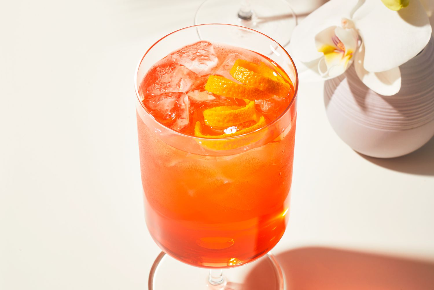 white rum and aperol spritz with orange peel garnish