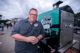 Southern Smoke founder Chris Shepherd and the Southern Smoke smoker, made by Pitmaker, which was raffled off to raise money.